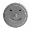Pierre de sauna amusante avec visage souriant pour la détente et la chaleur.