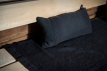 Housse de chaise de sauna Rento en noir et gris, 60x160cm, pour une assise confortable.