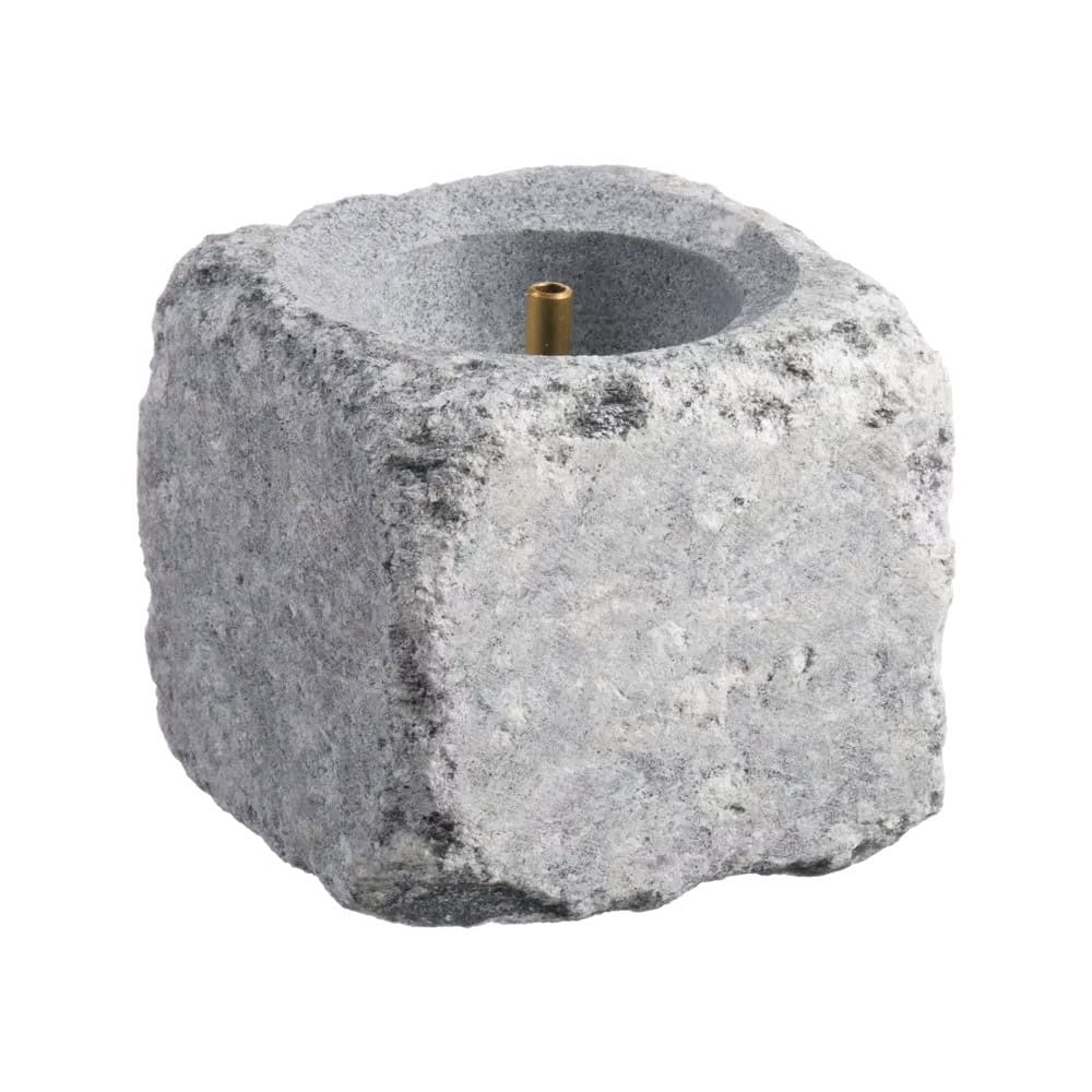 Poêle avec fontaine pour pierre à vapeur de sauna, fabriqué en pierre naturelle, idéal pour la détente et l'hydratation.