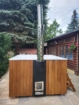 Hot tub PolarSpa Elite Quattro 180 avec finition bois et chaudière à bois intégrée.